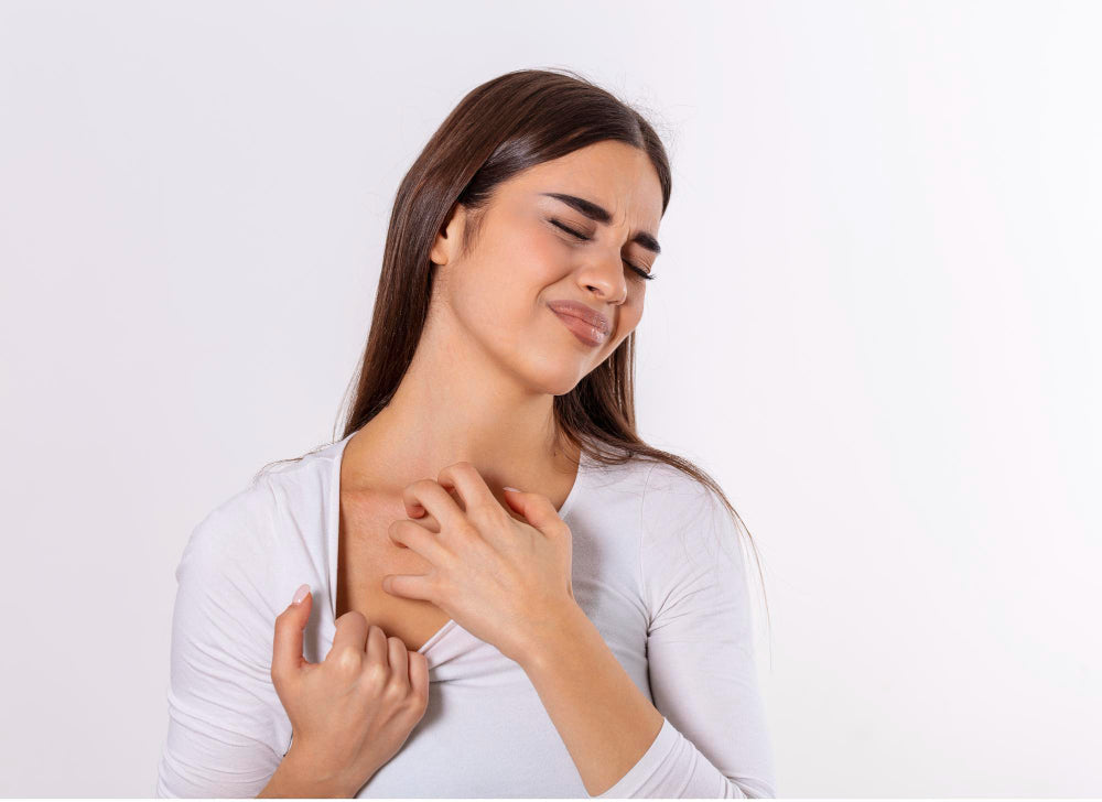 Woman scratching irritated skin on her neck due to eczema
