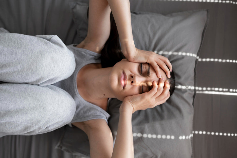 Woman using natural anxiety relief techniques in bed