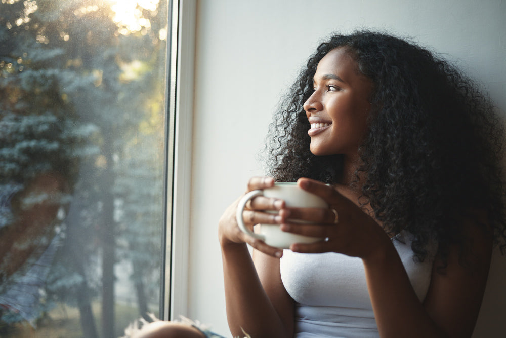Woman with a morning supplement drink