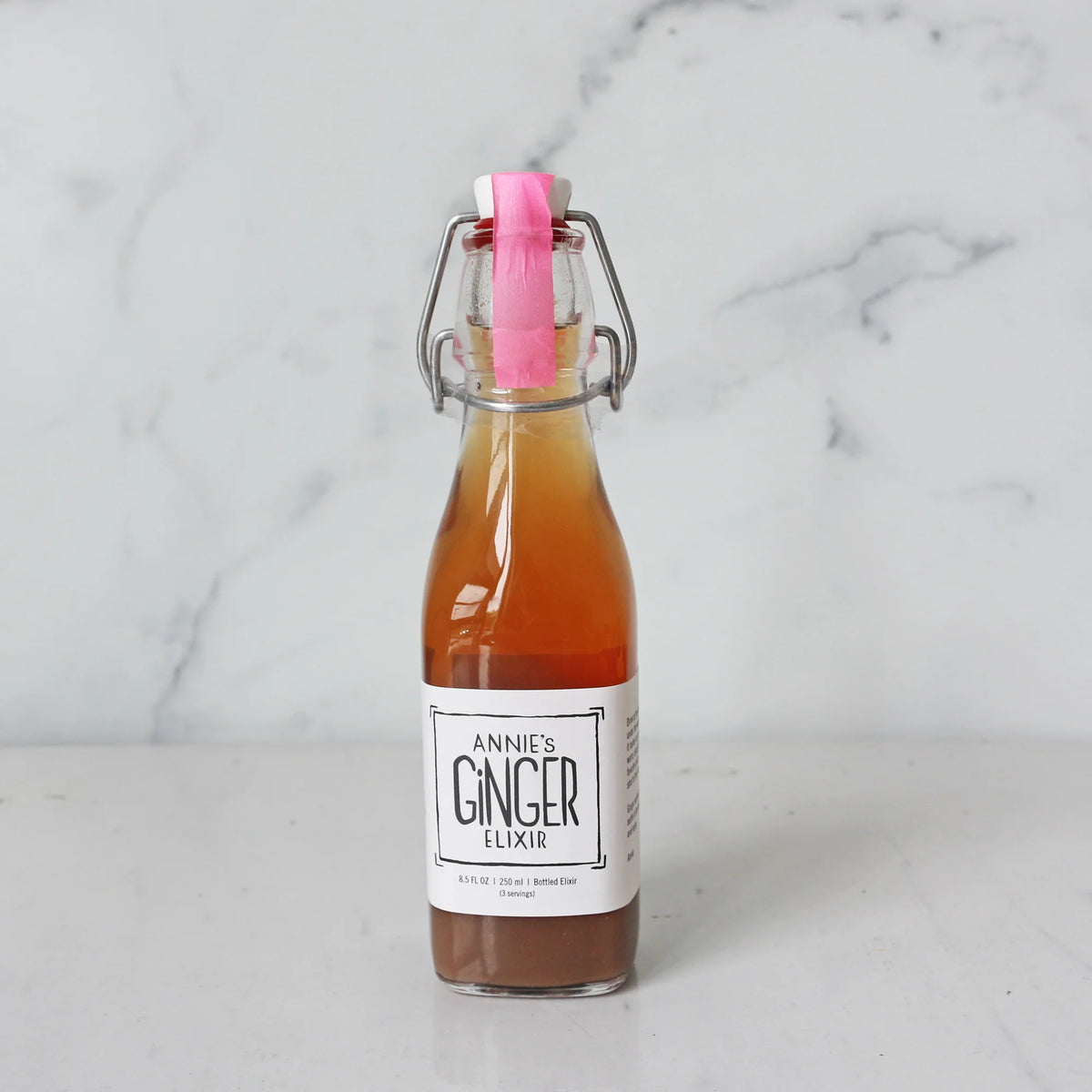 A glass bottle of Annie's Ginger Elixir 