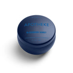 A mini tin candle in blackberry honey scent with dark blue packaging 