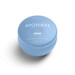 A mini tin candle in canvas scent with blue packaging 