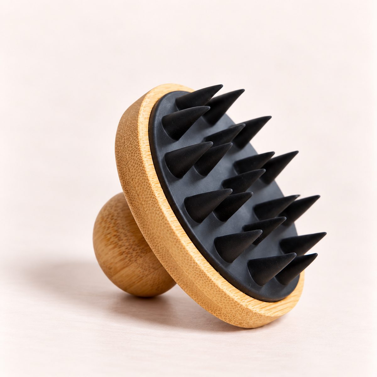 Wooden massage tool with black spikes