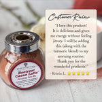 A jar of Beetroot Cacao Latte energy boosting blend by Roots to Refining Natural Living, shown next to a customer review card on a light marble surface.