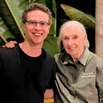 Two people smiling together outdoors, one wearing a Jane Goodall Institute shirt, representing the Burlap & Barrel Woodland Honey partnership