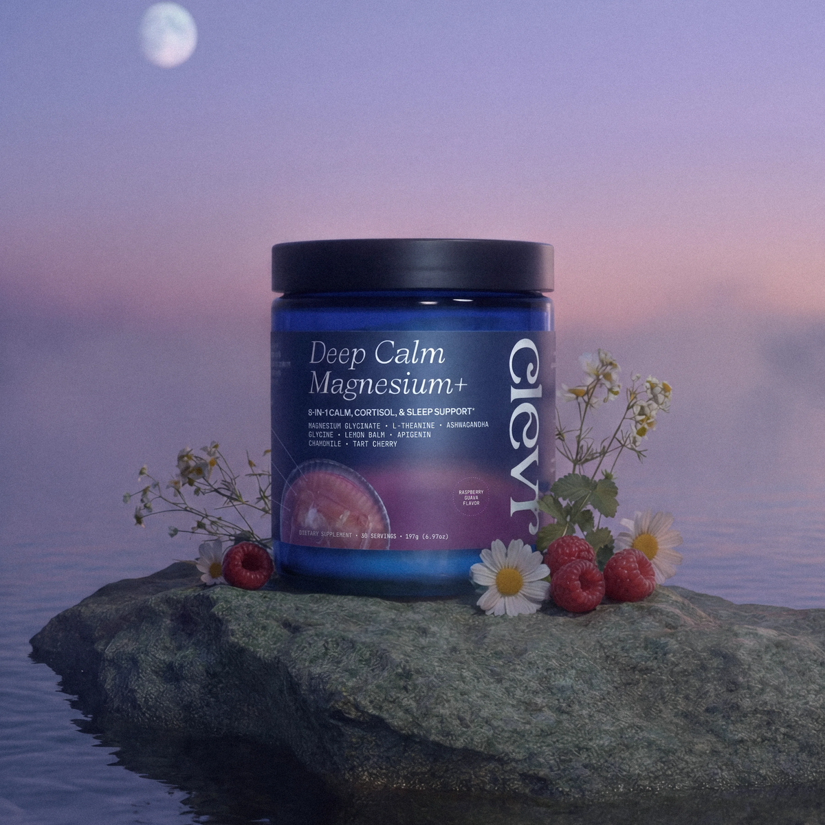 A blue jar of Deep Calm Magnesium+ supplement sits on a rock in calm water at sunset, with flowers, raspberries, and a moon in the background.