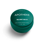 A mini tin candle in wild mint and ivy scent with green packaging 