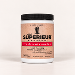 A white plastic tub of Superéur Electrolytes dietary supplement in the 'fresh watermelon' flavor, featuring a textured light brown label with a black lid, on a clean white background.