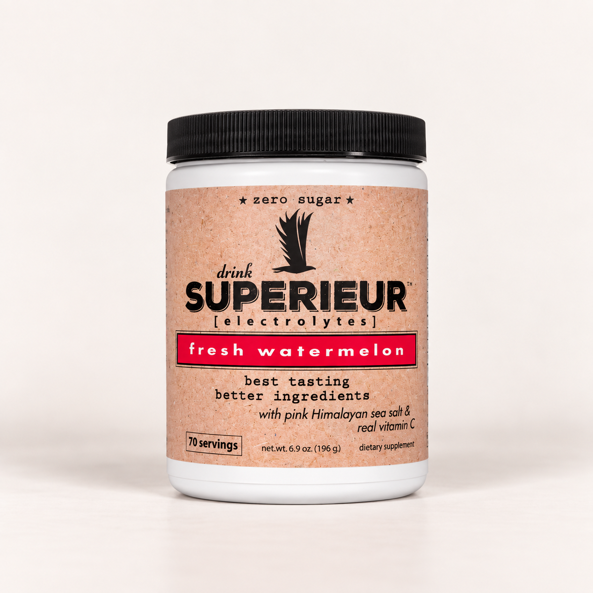 A white plastic tub of Superéur Electrolytes dietary supplement in the 'fresh watermelon' flavor, featuring a textured light brown label with a black lid, on a clean white background.