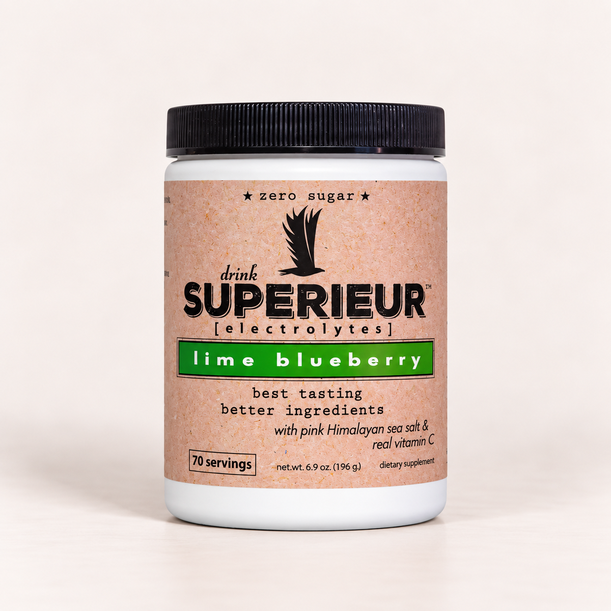 A white plastic tub of drink SUPERIEUR electrolytes in lime blueberry flavor, featuring a black ribbed lid and a tan label with green and black text, set against a plain off-white background.